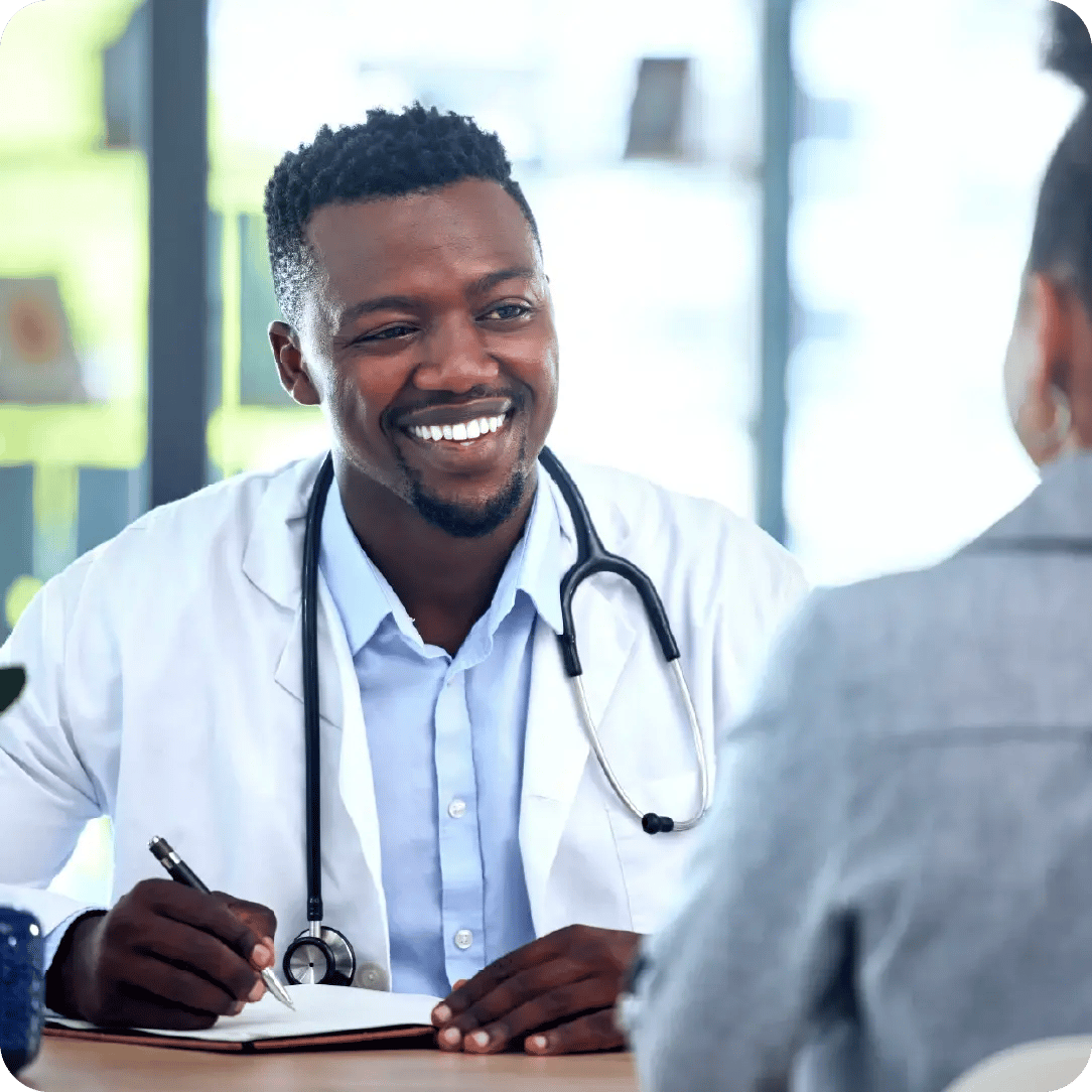 African doctor writing notes_Frequently Asked Questions_Altron HealthTech
