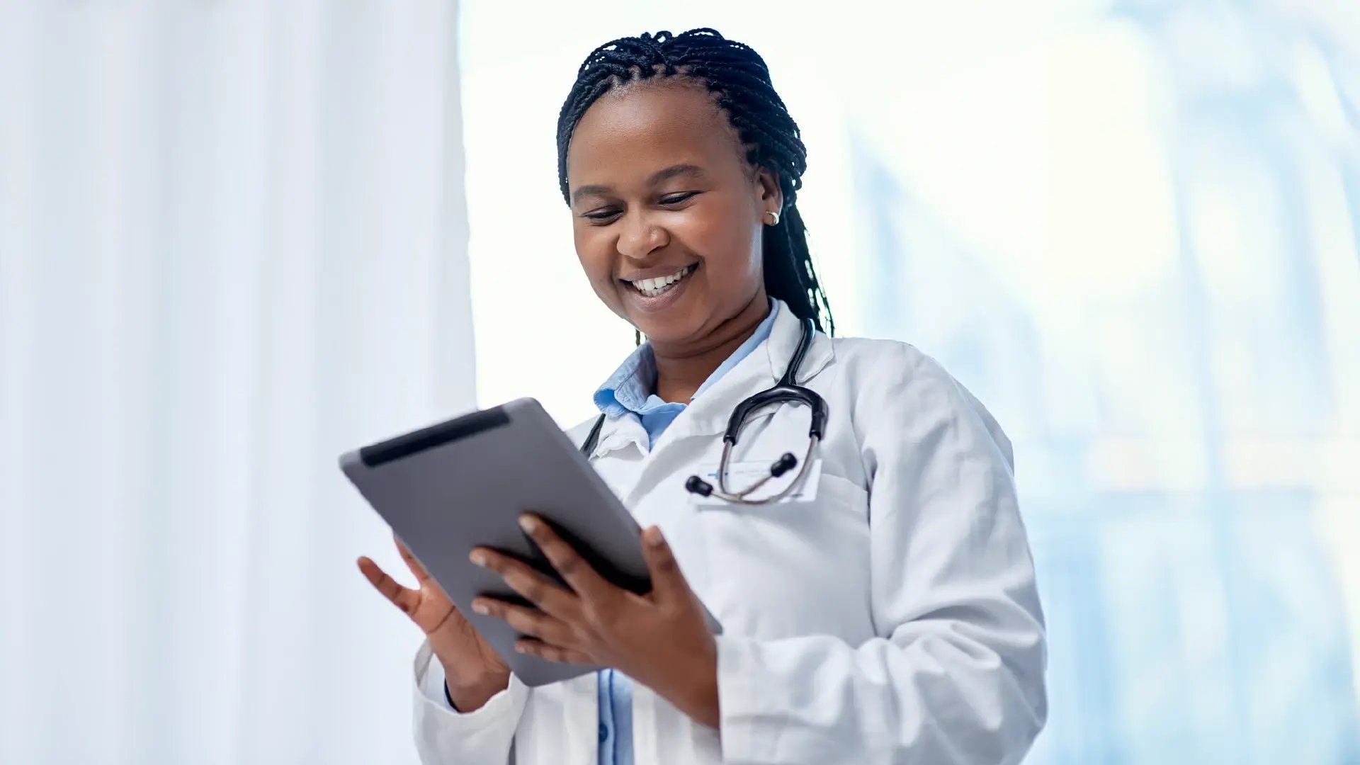 African woman doctor_Healthcare providers Connecting healthcare_Medical schemes_Altron HealthTech
