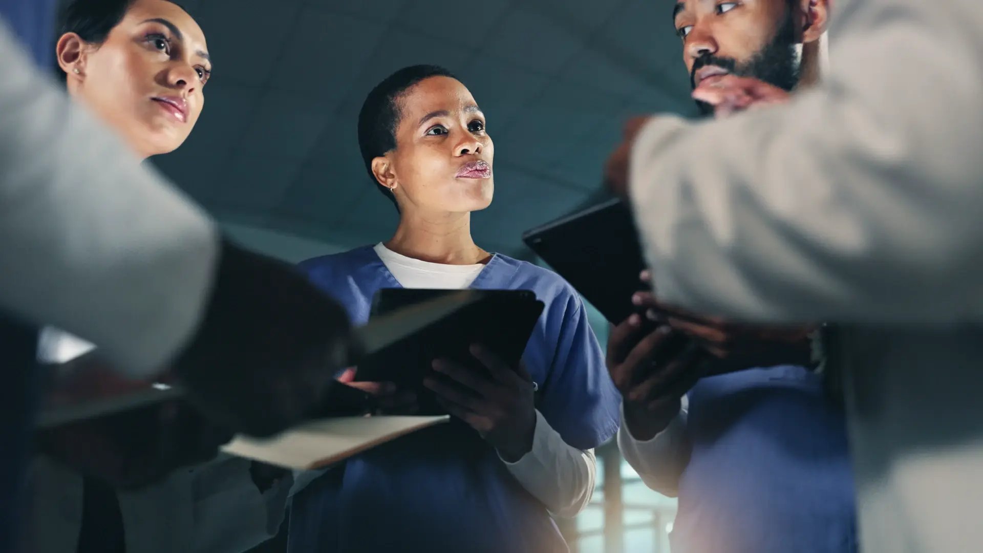 Connected oncology solution_doctor team meeting night planning surgery_Altron HealthTech