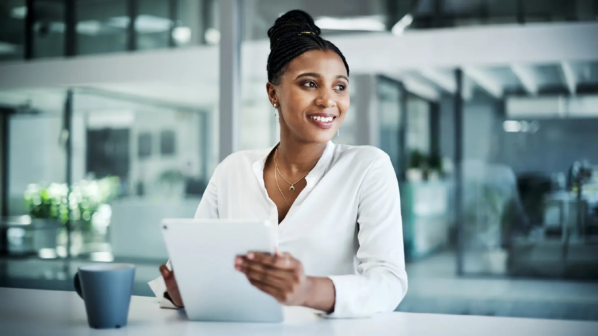 Corporate office tablet black businesswoman_Value added services for your practice_Altron HealthTech