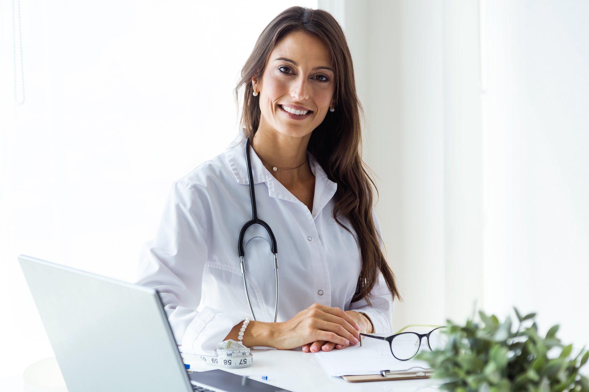 beautiful-young-female-doctor-looking-camera-office
